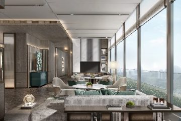 A room with a television and a large window Description automatically generated