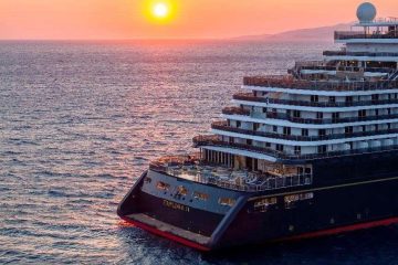 A large cruise ship in the water Description automatically generated