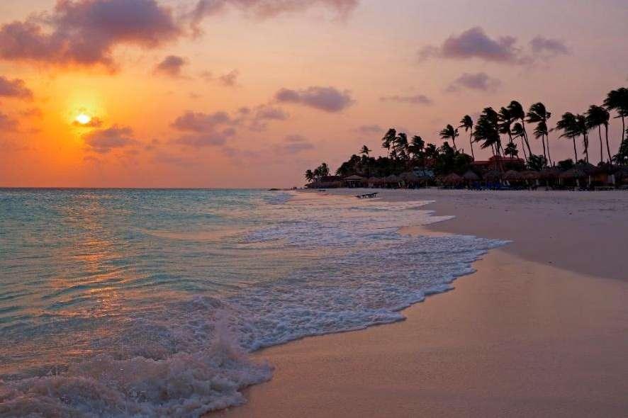 A sunset over a beach

Description automatically generated