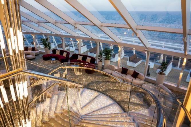 A room with a glass ceiling and a staircase

Description automatically generated