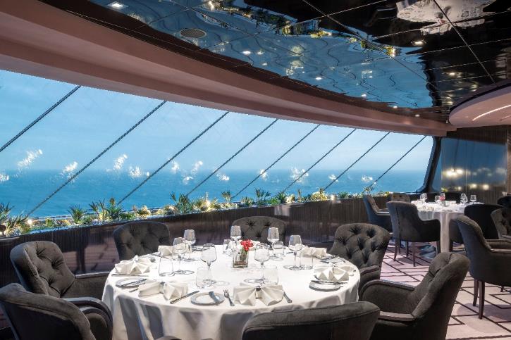 A restaurant with a view of the ocean

Description automatically generated