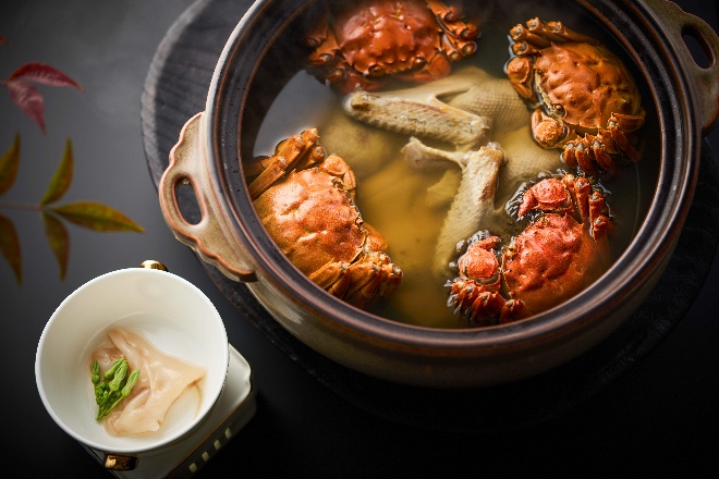 A bowl of crab soup

AI-generated content may be incorrect.