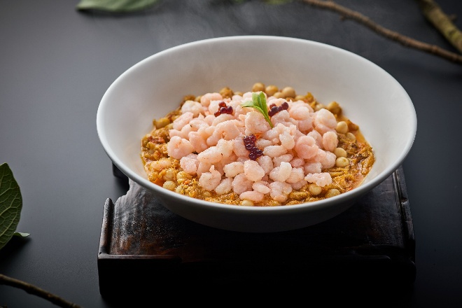 A bowl of food on a table

AI-generated content may be incorrect.