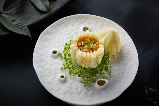 A plate of food on a black surface

AI-generated content may be incorrect.